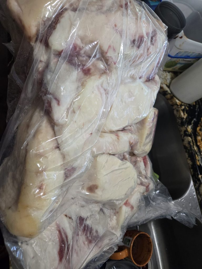 Large bag of beef fat trimmings ready to be rendered into tallow