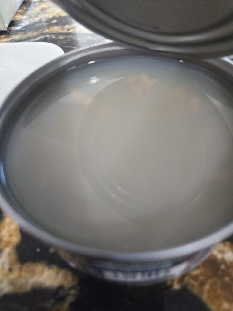 Clam juice in an opened can