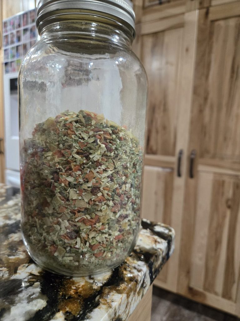 Mason jar filled with homemade dry soup mix with a gold lid