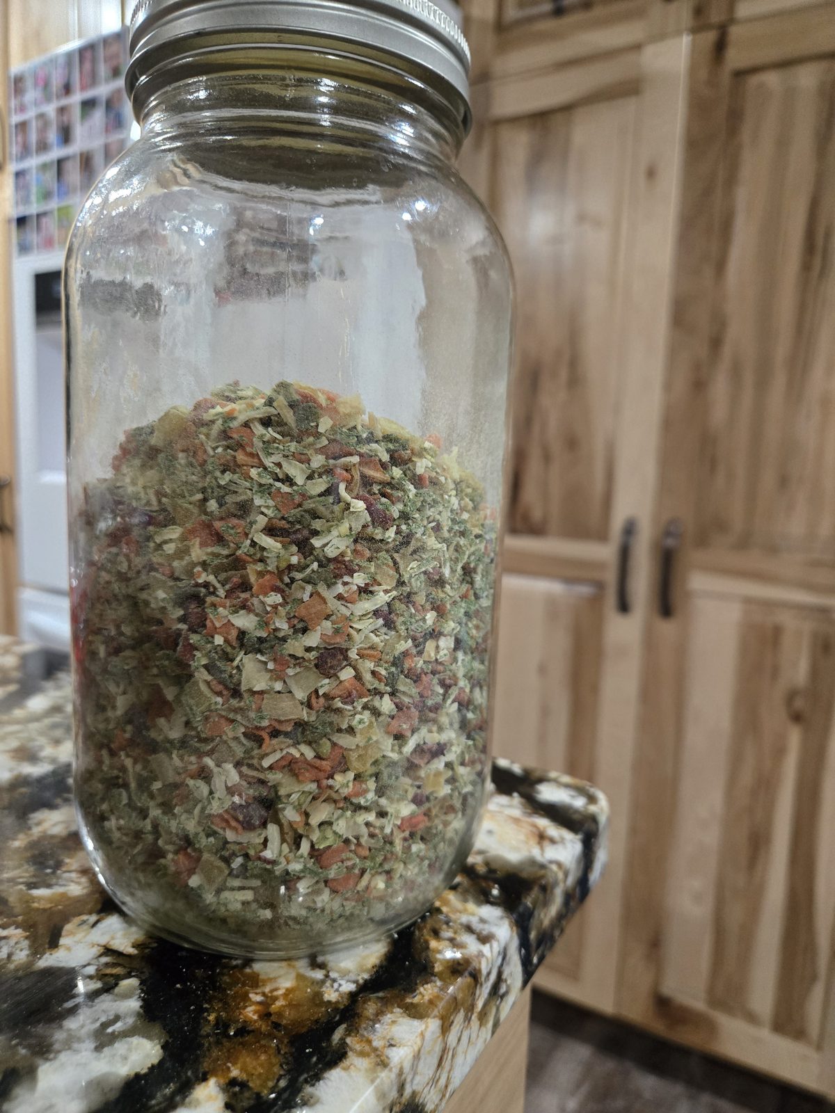Mason jar filled with homemade dry soup mix with a gold lid