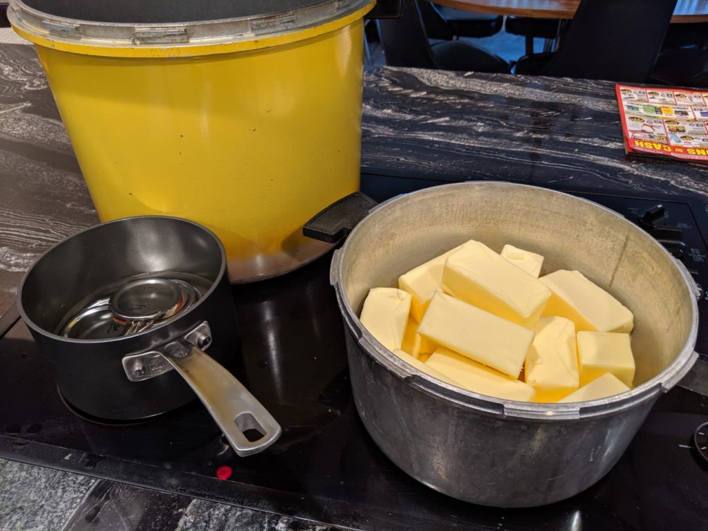 Butter melting in a large pot on the stove